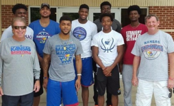 Group photo against brick wall